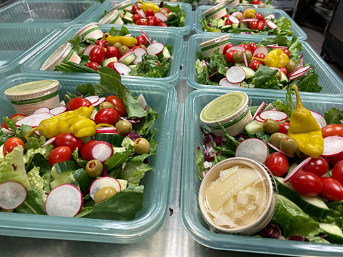 Image of reusable takeout boxes with food